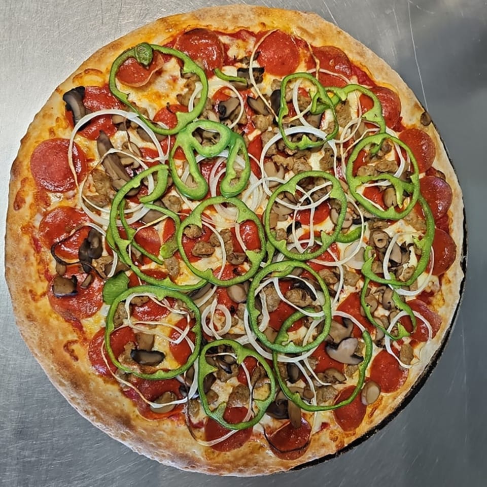 Big's Pizza and Subs' pepperoni pizza with green peppers, onions, mushrooms, and sausage.