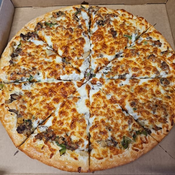 A Big's Pizza and Subs pizza, cut into eight slices, with melted cheese and toppings.