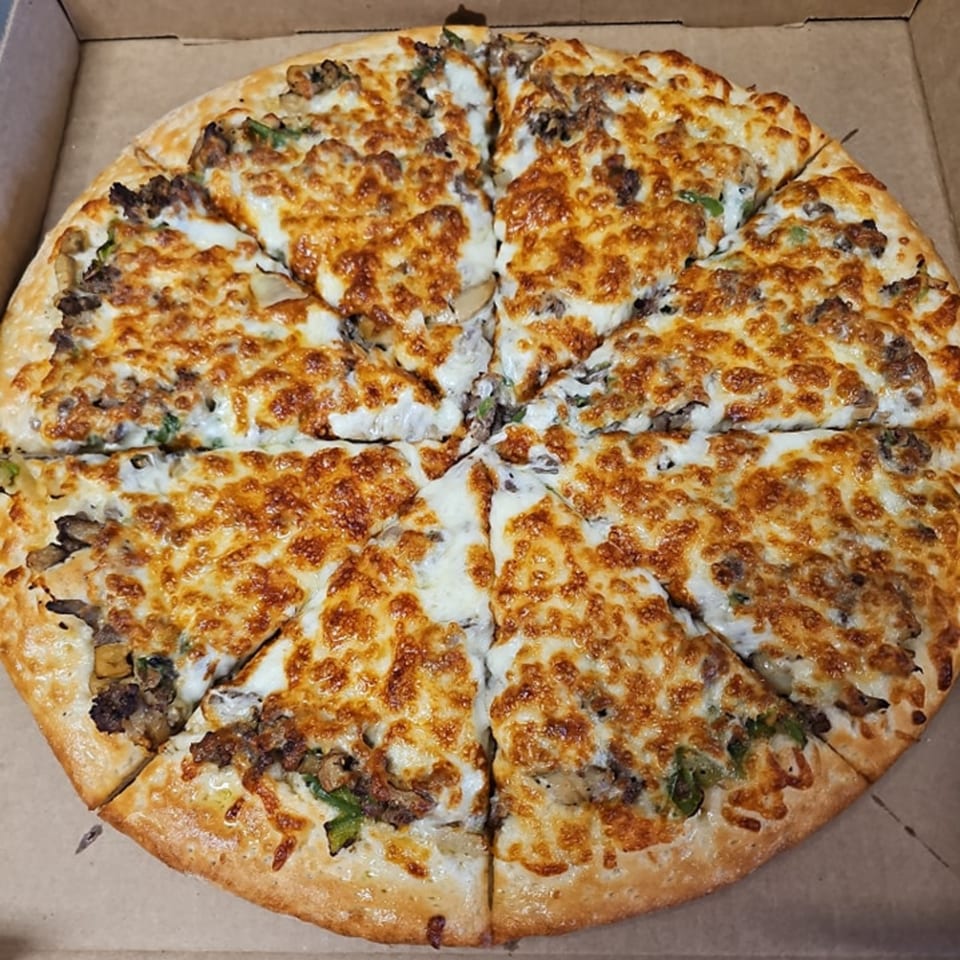 A Big's Pizza and Subs pizza, cut into eight slices, with melted cheese and toppings.