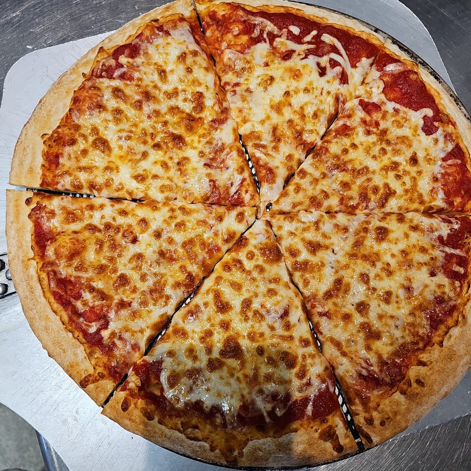 A freshly baked, sliced Big's Pizza and Subs cheese pizza with melted golden-brown mozzarella.